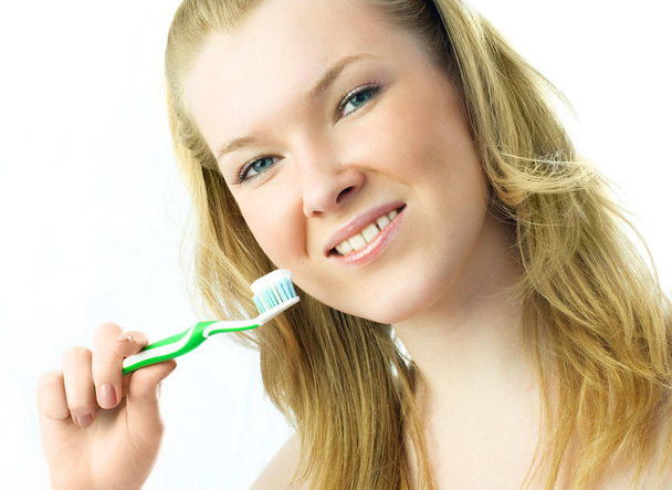 Woman brushing her teeth - 写真・画像