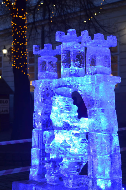 Sculptures cut out of ice. Art object. Ice figure highlighted with colored light. - Photo, Image