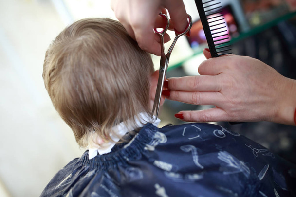 Barber cutting hair of child - Photo, Image