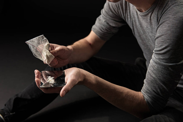 Man arms emptying coke from packaging - Φωτογραφία, εικόνα