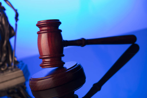 Law and justice concept. Themis statue and judges gavel on blue background. Place for text. - Photo, Image
