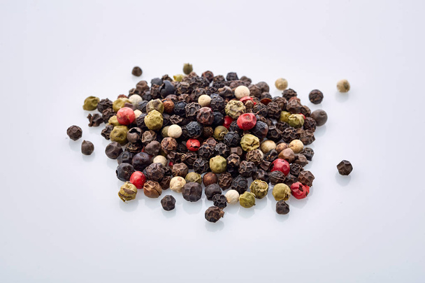 Seasoning - four kinds of pepper peas - isolated on white background - Valokuva, kuva