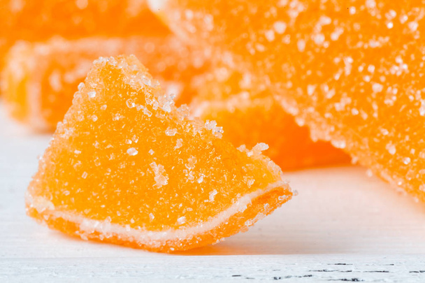 Orange marmelad with slided oranges on table - Фото, зображення