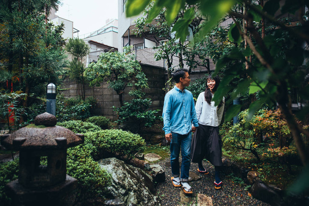 Young japanese couple spending time in their house - Foto, Imagen