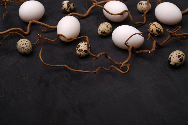 Stylish eggs with decorative elements on black background. - Fotografie, Obrázek