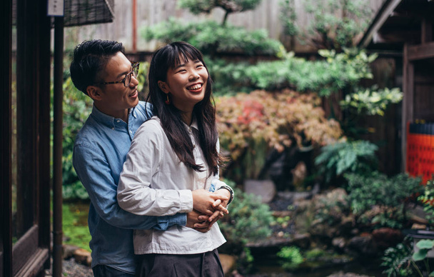 Young japanese couple spending time in their house - Photo, Image