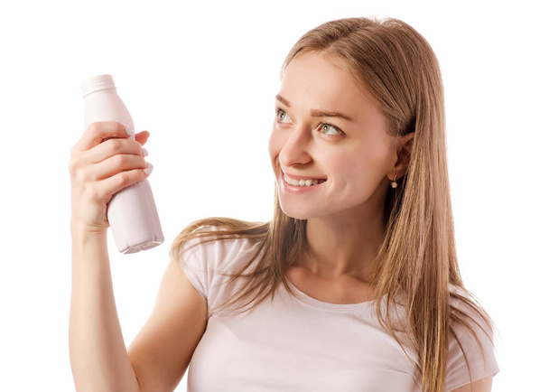 Beautiful young woman in the hands of bottle yogurt - Zdjęcie, obraz