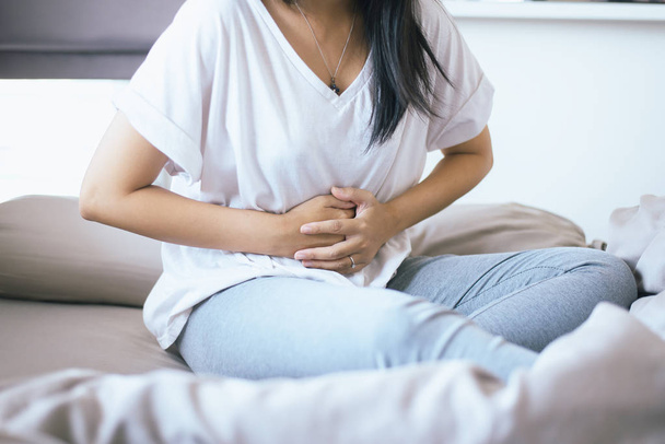Woman having painful stomachache,Female suffering from abdominal pain - Φωτογραφία, εικόνα