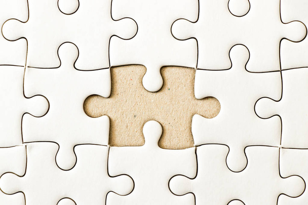 Closed up background of white plain jigsaw wait missing piece to match or fulfill - Photo, Image