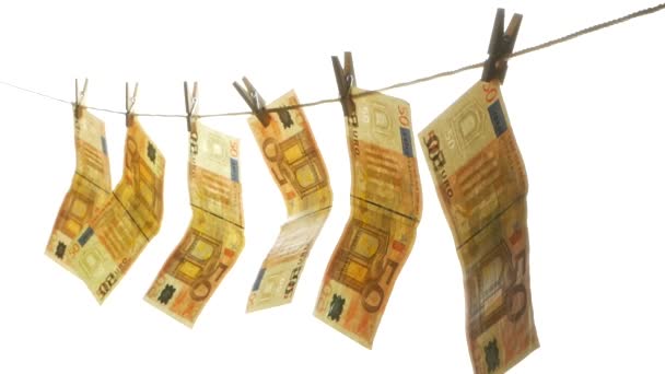 The Euro banknotes attached with clothespins on the rope. - Video