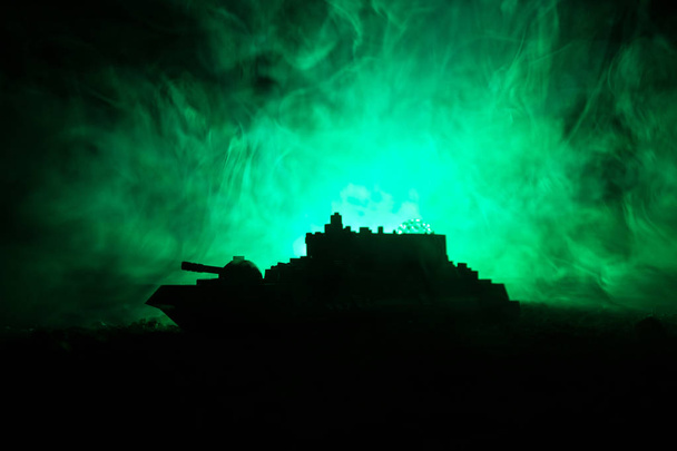 Silhouette of military war ship on dark foggy toned sky background. - Foto, imagen