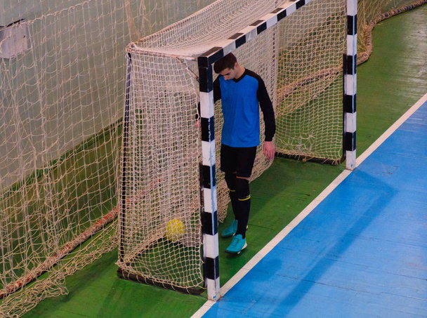 Football goalkeeper on goal, field, Futsal ball field in the gym indoor, Soccer sport field - Foto, Imagem