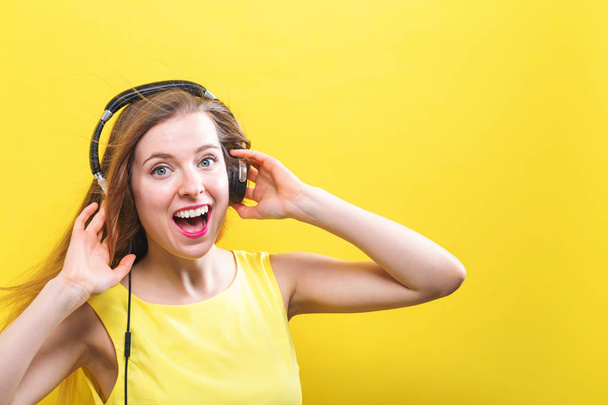 Happy young woman with headphones - Фото, зображення