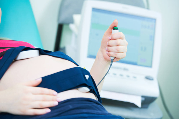 Pregnancy care. cardiotocography fetal heartbeat examination - Fotoğraf, Görsel