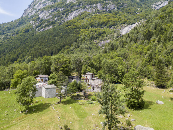 Aerial view of the Mello Valley, Val di Mello, a green valley surrounded by granite mountains and forest trees, renamed the little italian Yosemite Valley by the nature lovers. Italy - Photo, Image
