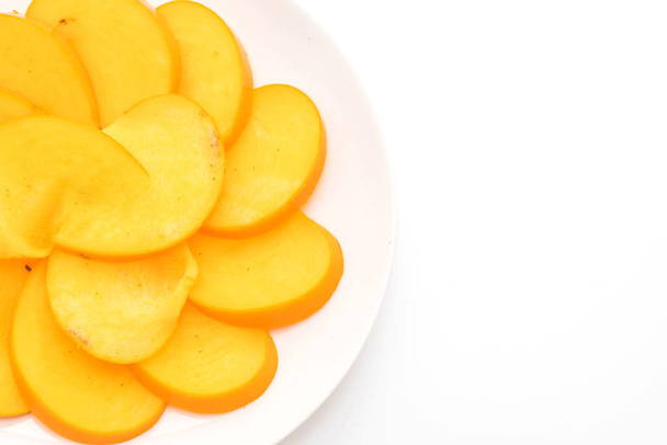 sliced fresh persimmon - Foto, imagen