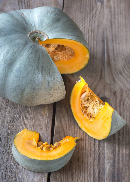 Ripe pumpkin on the wooden background - Photo, Image