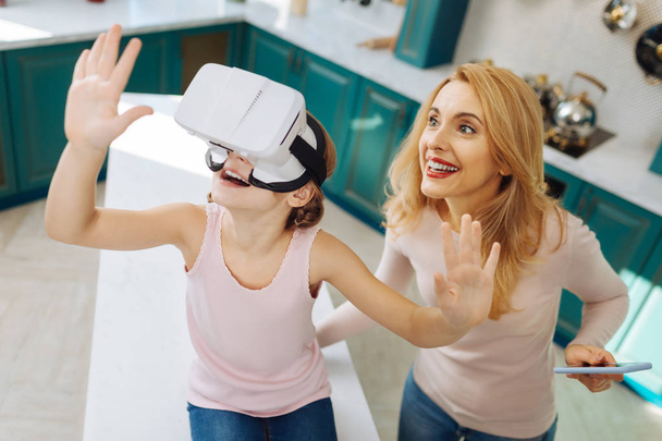 Cheerful girl wearing VR headset - Photo, Image