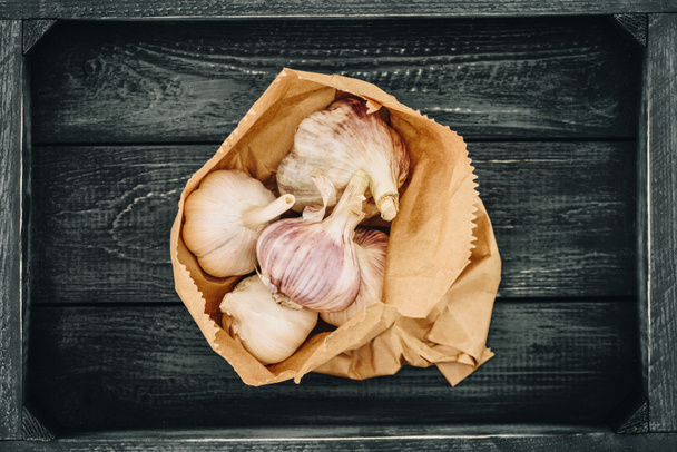 top view of garlic in shopping paper bag - Photo, Image