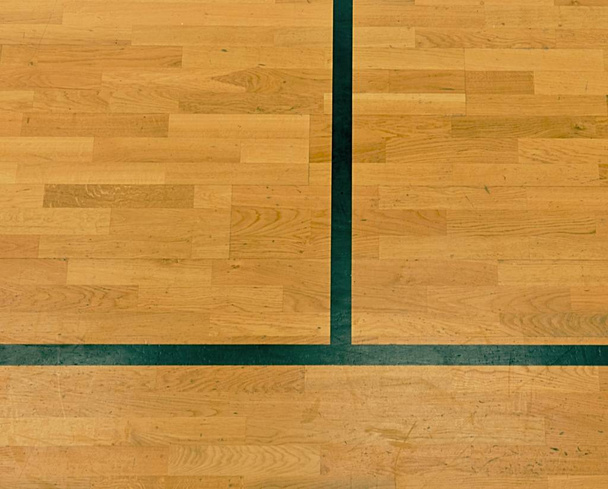 Black lines in hall playground. Worn out wooden floor of sports hall with lines - 写真・画像