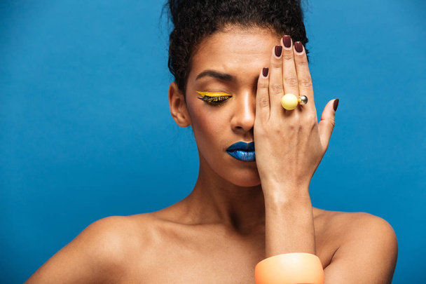 Beauty photo of relaxed mixed-race woman with colorful cosmetics - Fotografie, Obrázek