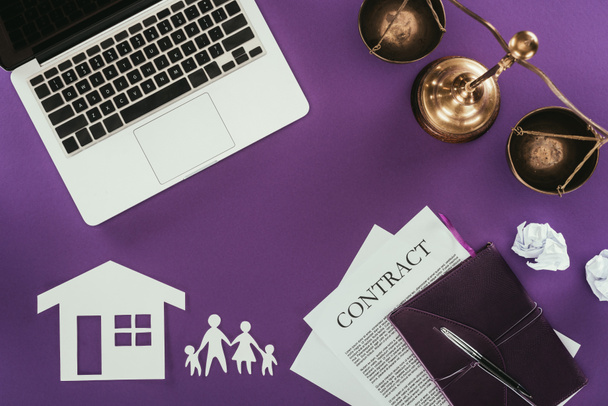 top view of business workplace with home and family insurance oncept on purple tabletop - Photo, Image