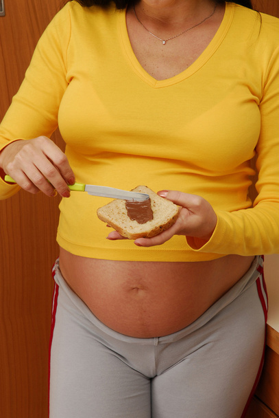 Pregnant woman eating - Foto, Imagen