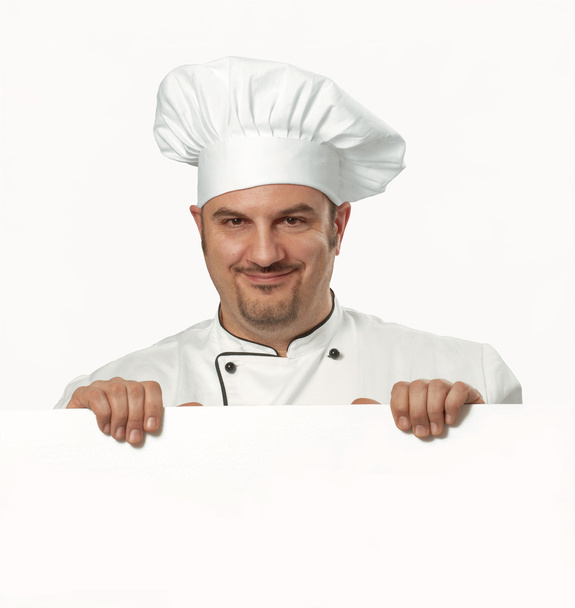 Cook holding white card. Cook holding white panel. - Foto, afbeelding