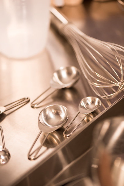 close up view of kitchen utensils on metal counter in restaurant - 写真・画像
