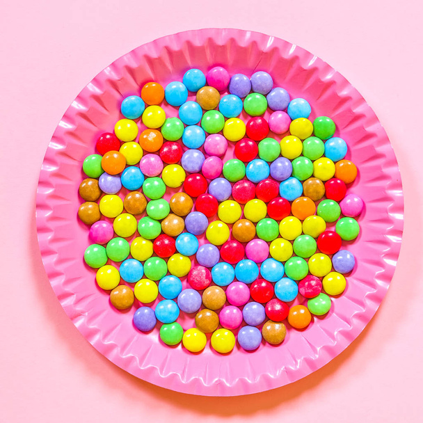 colorful bonbons  on plate background - Photo, Image