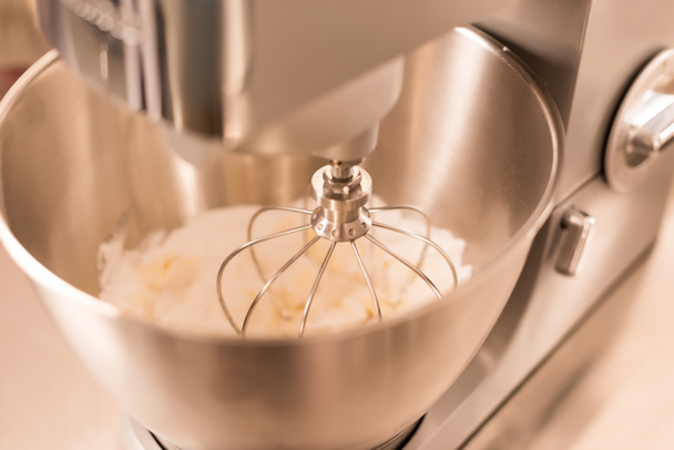 close up view of food processor whipping cream - Фото, зображення