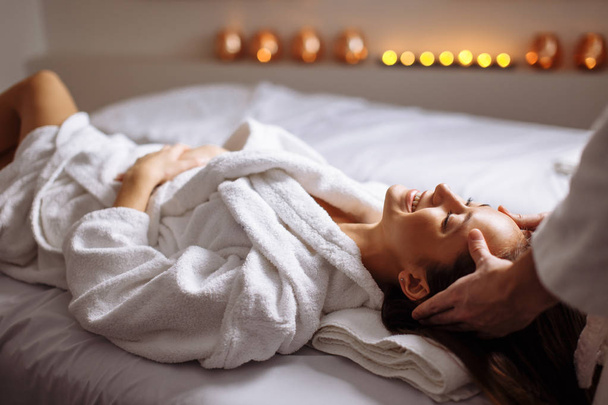 girl having spa facial massage in luxurious beauty salon - Valokuva, kuva