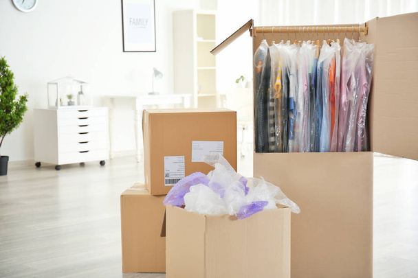 Wardrobe boxes with clothes   - Фото, изображение