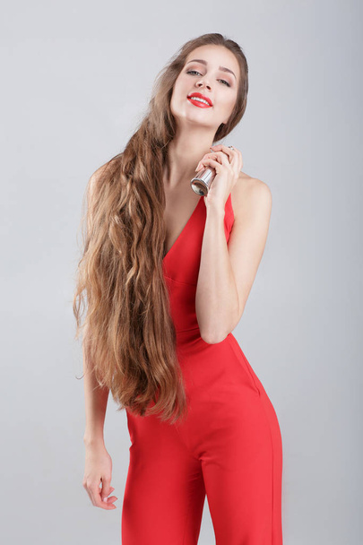 woman in red dress with perfume - Fotoğraf, Görsel