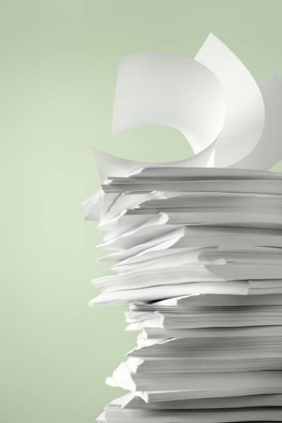 Stack of Papers against a plain color background - Photo, Image