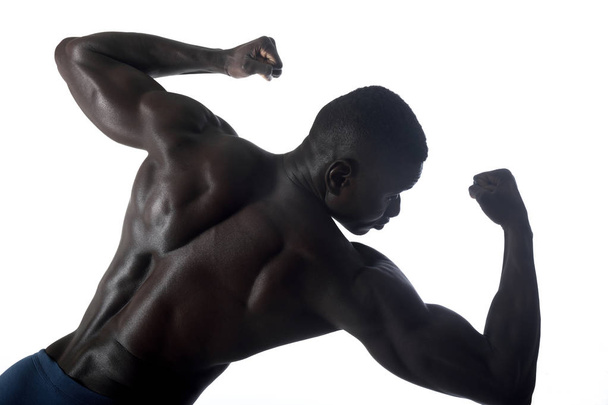 portrait of a black athletic man on his back - Foto, Imagen