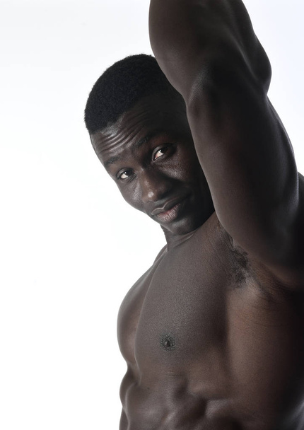 portrait of a muscular man on white background - Foto, Bild