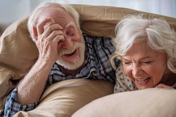 Cheerful old married couple having rest at home - Photo, Image