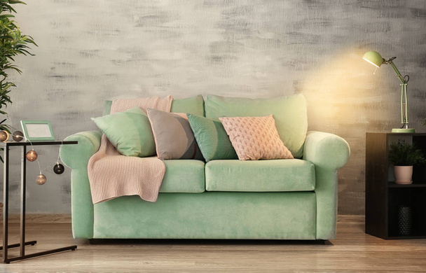 Living room interior with comfortable mint couch - Foto, afbeelding