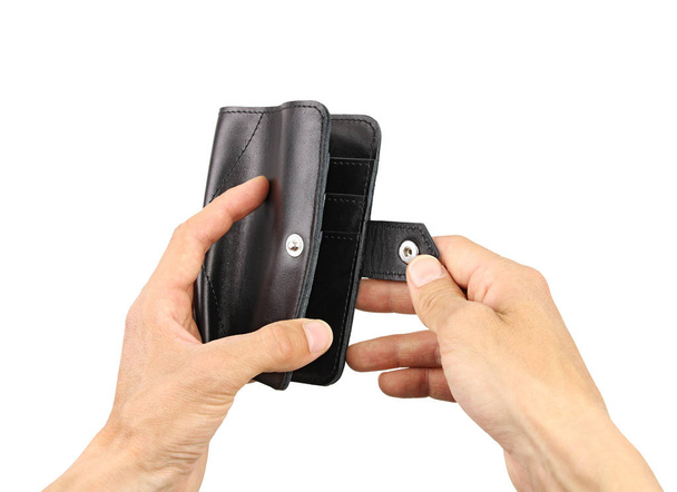 menselijke handen unbuttons portemonnee, geïsoleerde achtergrond   - Foto, afbeelding