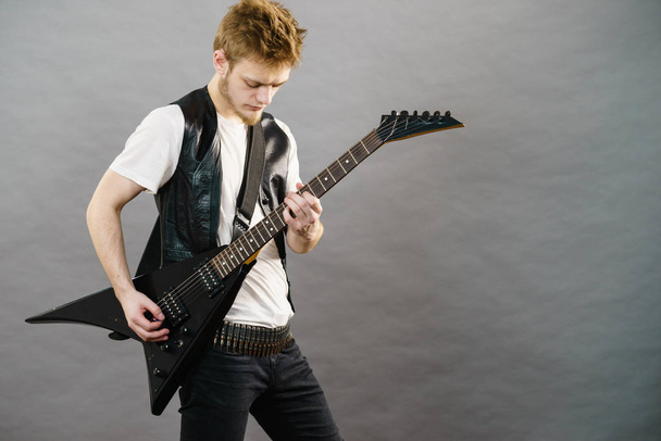 Young man playing electric guitar - 写真・画像