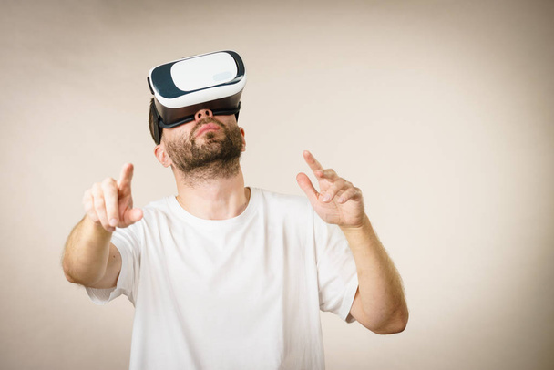 Adult man wearing vr goggles - Photo, Image