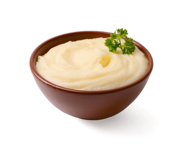 Bowl with mashed potatoes on white background - Fotó, kép