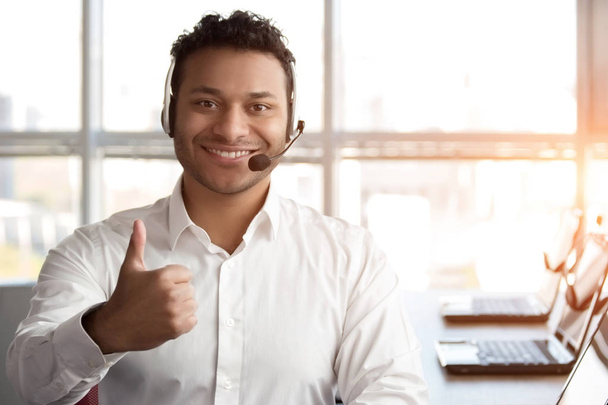 Indian black call center operator shows thumb up. - Photo, Image