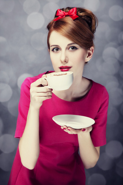 Redhead girl with coffee cup. St. Valentine - Zdjęcie, obraz