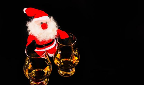 Santa Claus with single malt whiskey glass, Symbol of Christmas  - Photo, Image