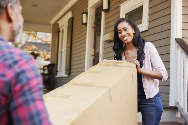 Couple Carrying Big Box Purchase Into House - Photo, Image