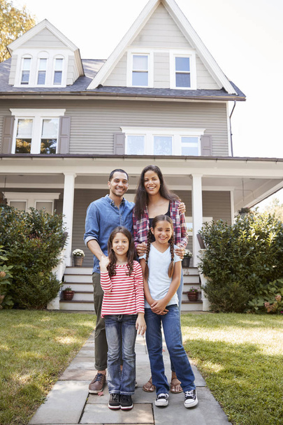 Portrait Of Smiling Family Standing In Front Of Their Home - Photo, image