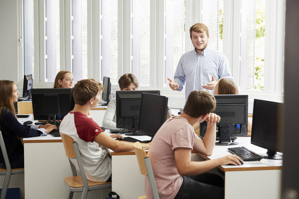 Teenage Students Studying In IT Class With Teacher - Zdjęcie, obraz