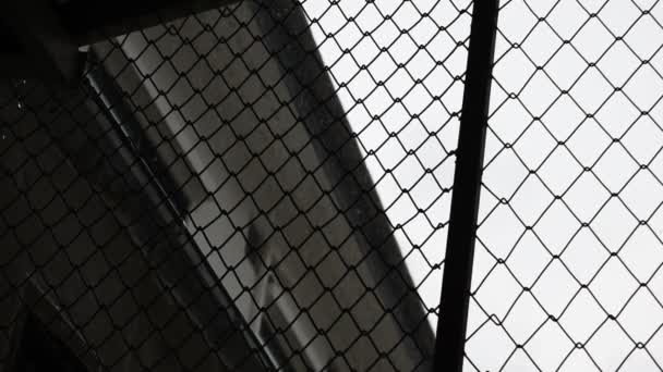 Rainy atmosphere the look through the steel cage. - Footage, Video